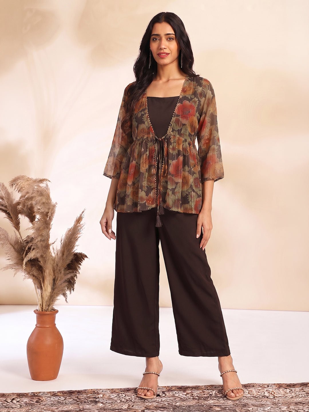 JAA26ST04589_1.jpg Brown Chiffon Solid Shoulder Strap Crop Top with Trouser Floral Printed Shrug - Image 1